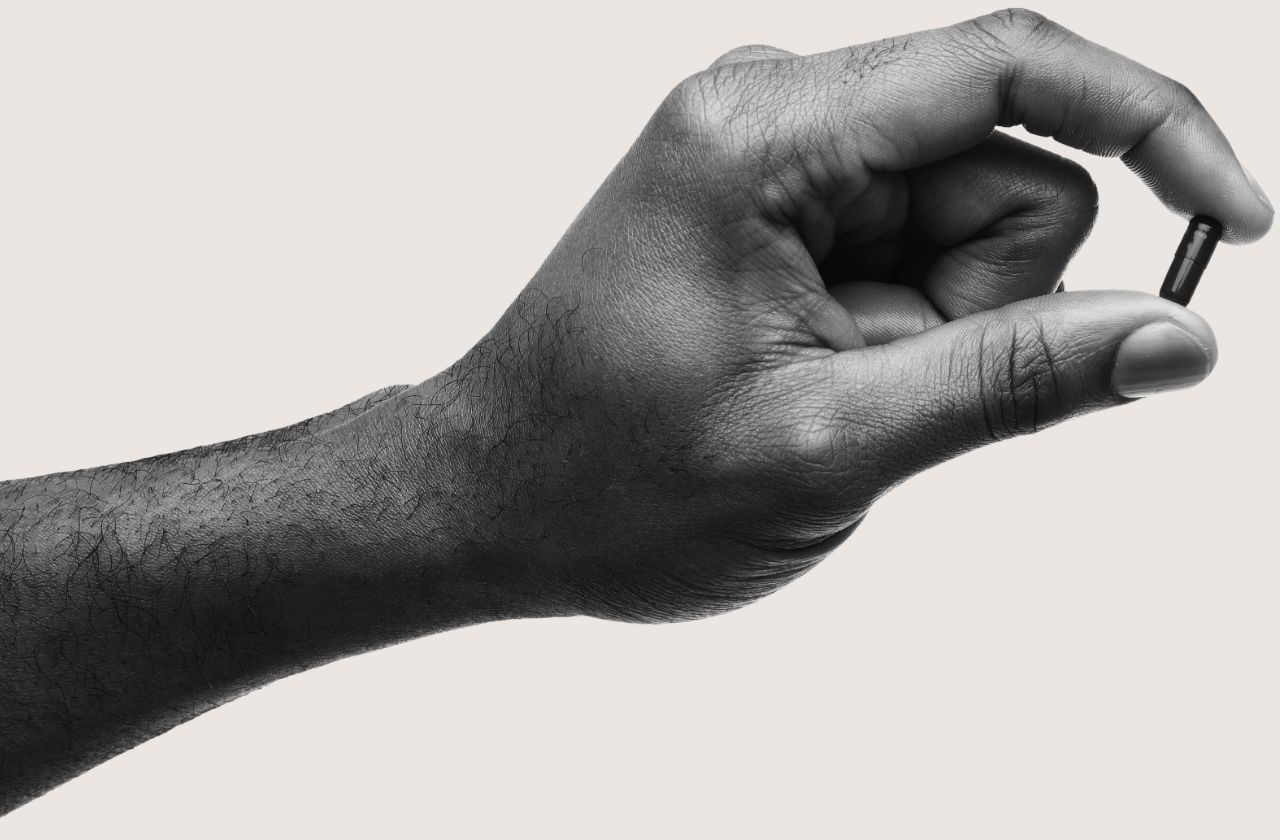 Person holding pill